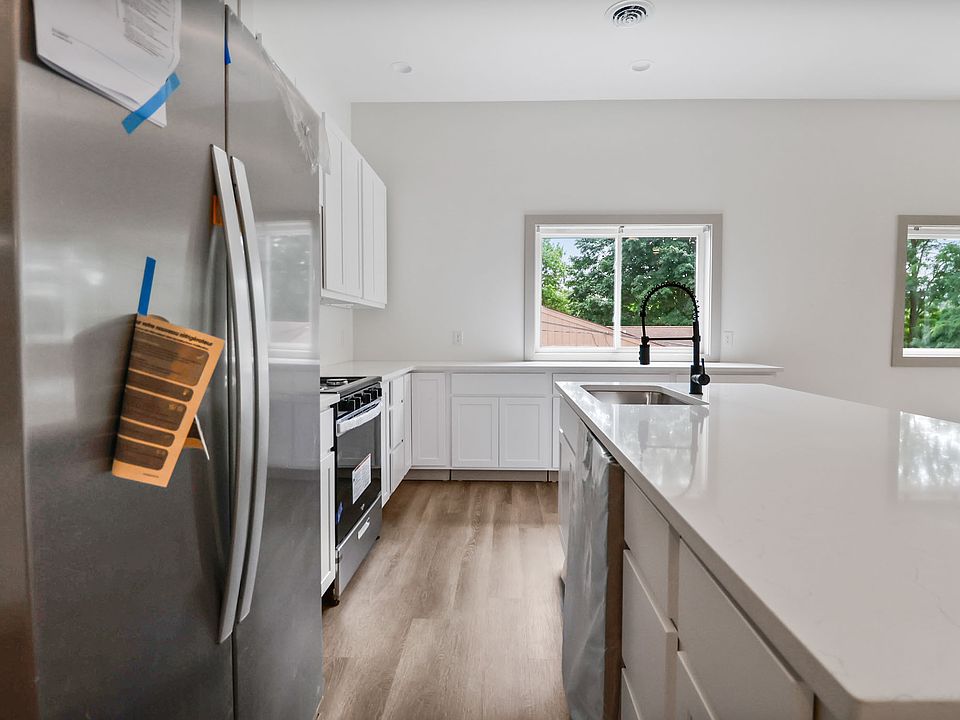 Gorgeous new white shaker cabinets, white quartz counters and SS appliances. Toe kicks are getting installed.