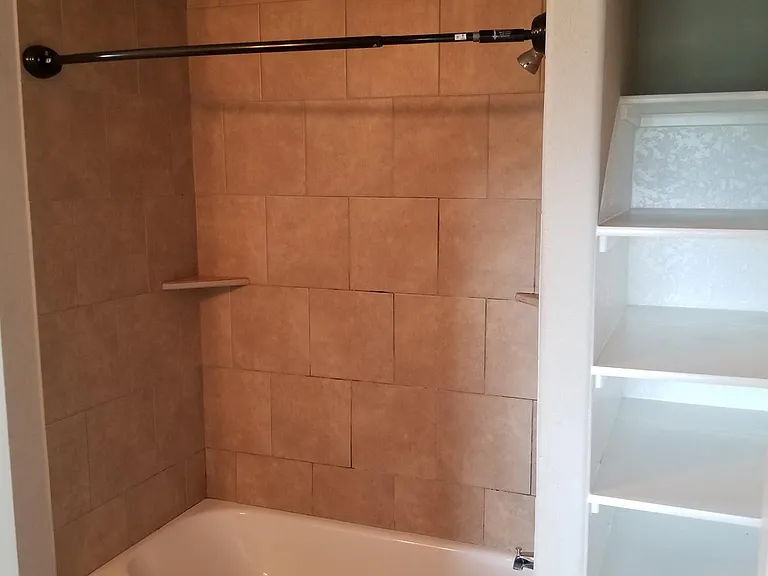 Master bath with shelving for storage