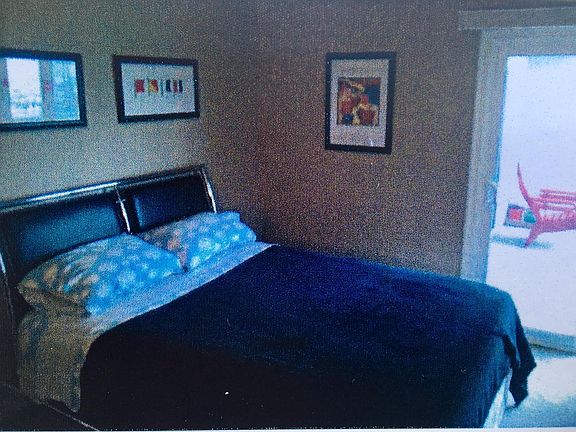 bedroom with access to patio