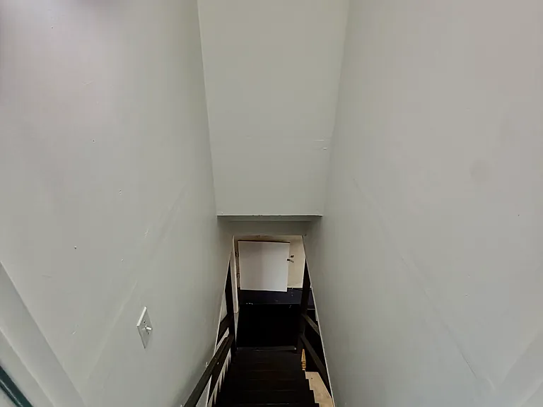Stairs leading to garage and 1st Floor In-law unit