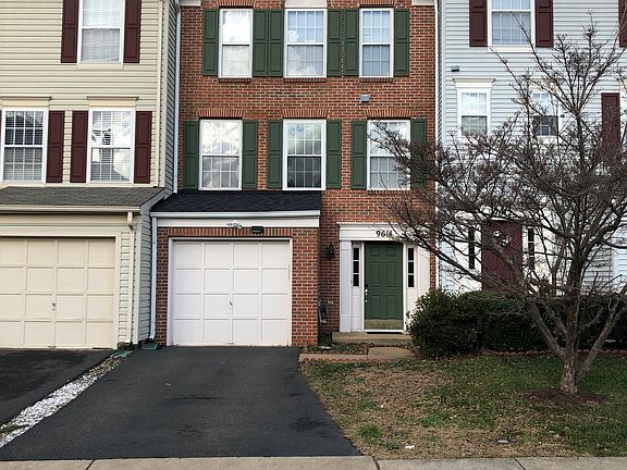 Brick town home with one car garage