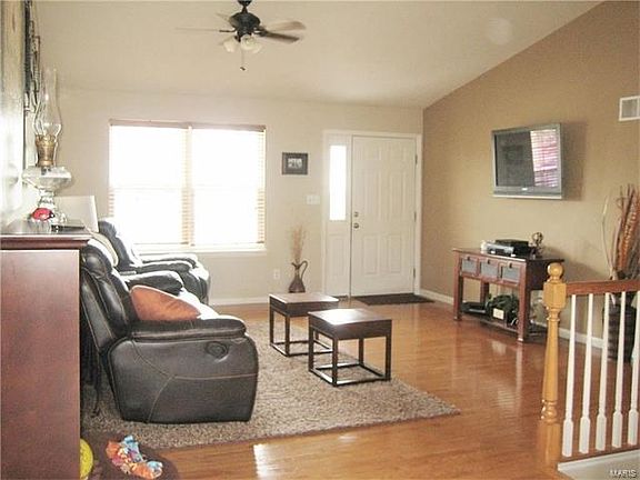 Vaulted Great room with REAL hardwood floors.