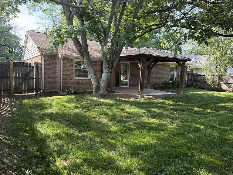 Back of house, covered patio & yard