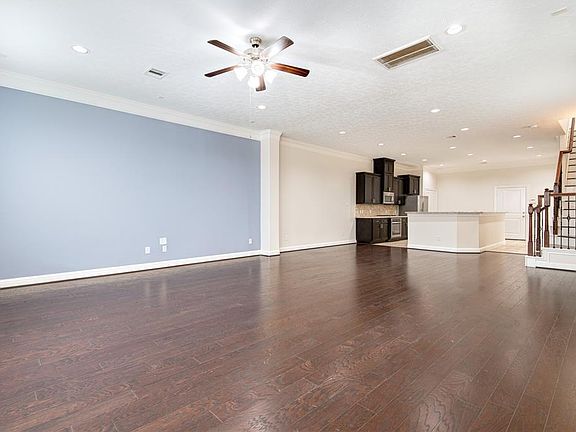 20x12 Dining - A look at the big picture and relationship between the dining, kitchen and living spaces. The door in the background leads to the garage.