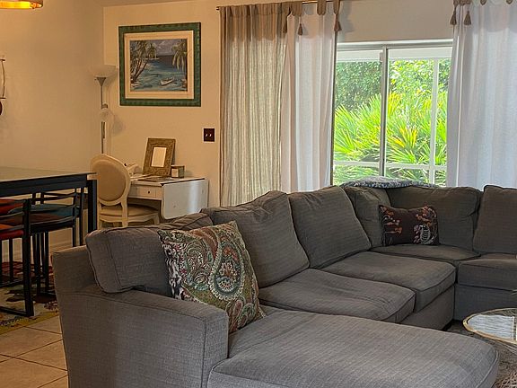 Sectional seating in Great room , sliders to screened lanai
