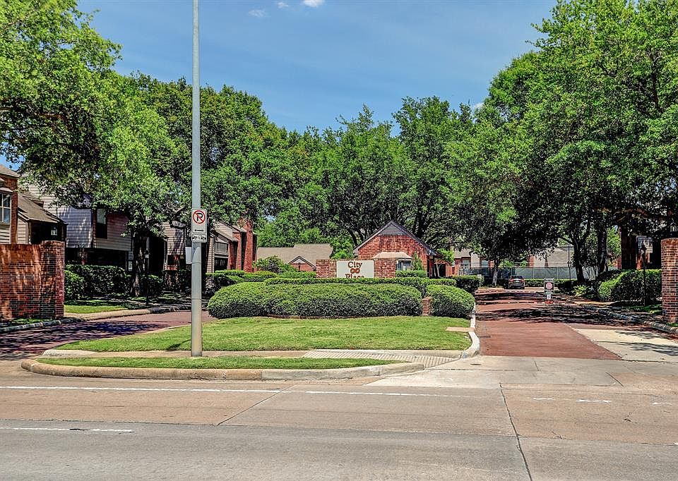 7447 Cambridge St. entry and exit driveways on each side of the manned Security Guard House. Visitors must present their business card or give information to Guard on duty, saying which TH visitor is going to. Visitor pkg. is just beyond the guard ho