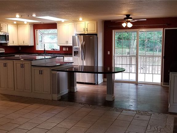 There are many outstanding aspects to this home. Granite countertops, tile and hardwood floors, built in book cases.