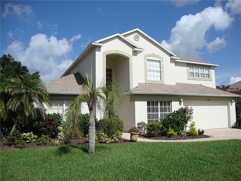 Front view of the home with it's tall arched entry.