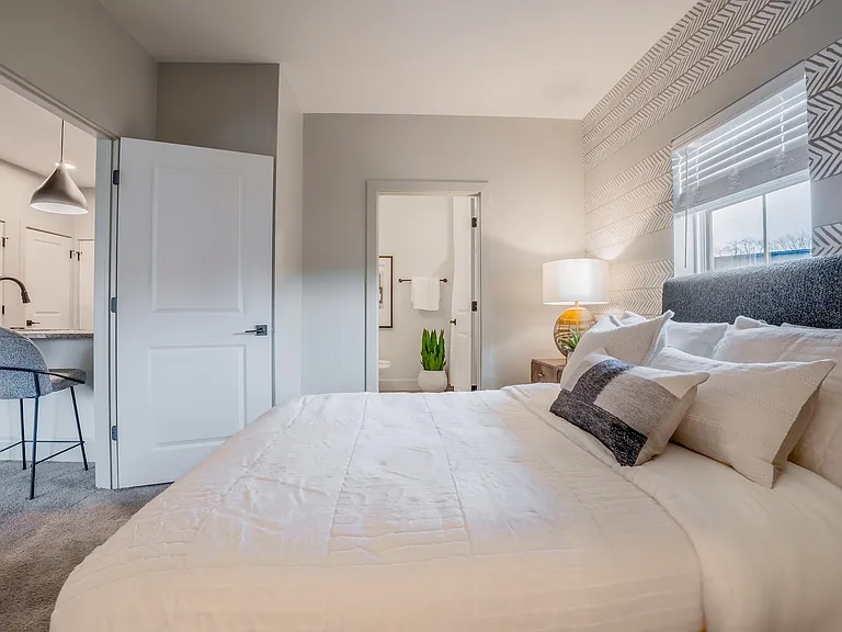 Experience serene comfort in this beautifully designed bedroom retreat.