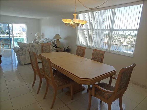 PANORAMIC WATER VIEWS FROM THIS 2BED/2BATH CORNER UNIT STEPS FROM THE BEACH