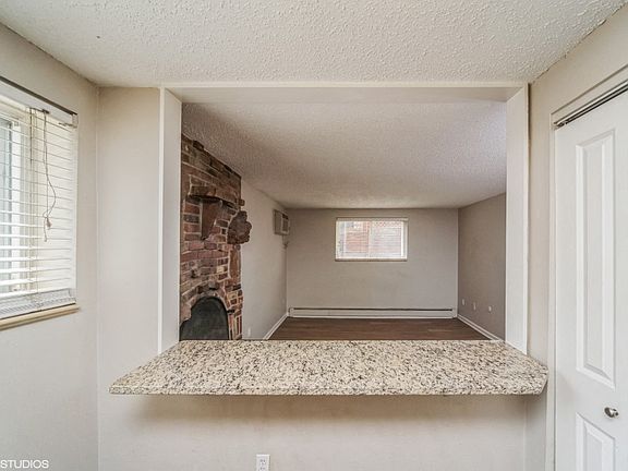 Kitchen with a breakfast bar overlooking the living room