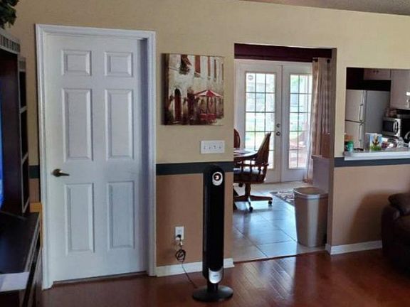 great room to kitchen with current colors