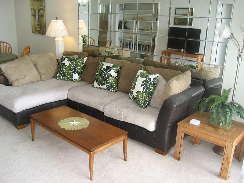 Living area boasts playpen sofa looking at view