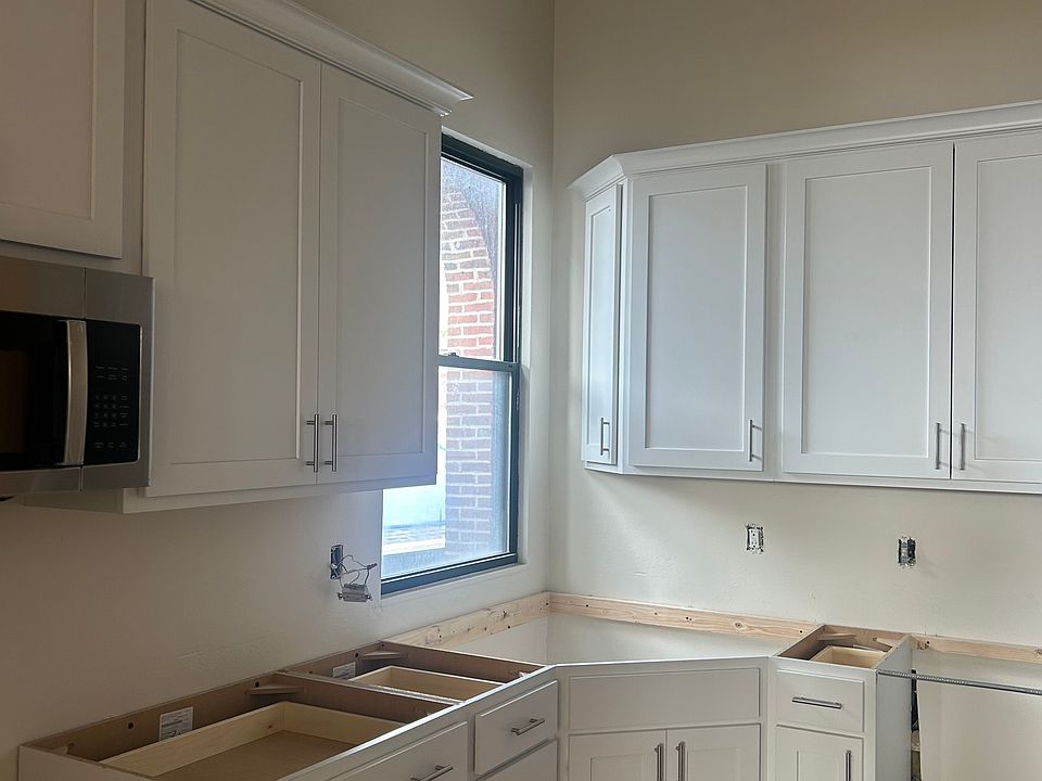 Brand new custom cabinets, counter and stainless appliances in process.