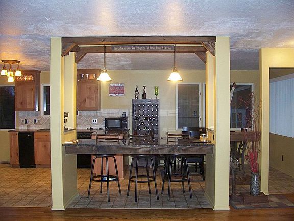 view between lr/kitchen/dining.built in granite eating bar!