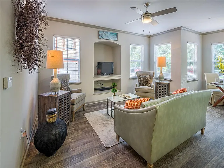 Model living room with numerous windows