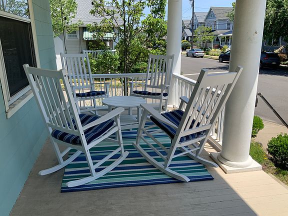 Relax on the large front porch. Four comfy rocking chairs and a small table.