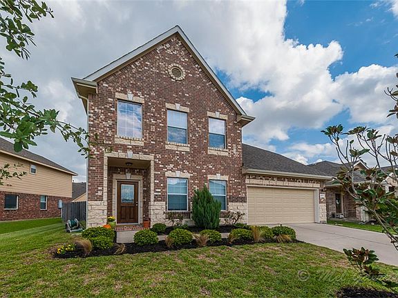 The brick elevation with stone accents adds distinction.