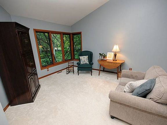 Walking through the front door you're immediately greeted with a large warm living room (13x15) flooded with natural light from the array of windows.