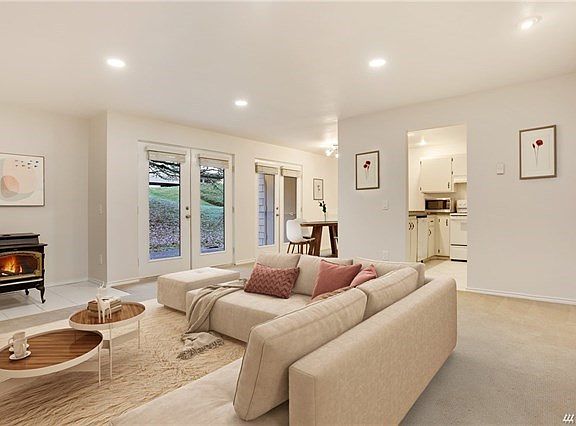 Perfectly appointed, open concept home. Ground unit with formal dining area, French doors to large patio and storage. Light and bright!