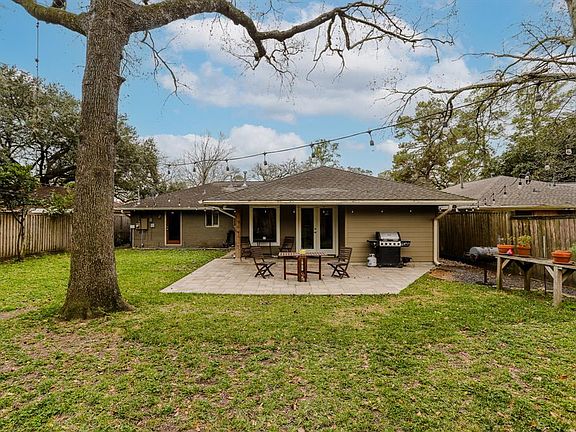 Extra large backyard with a covered patio.