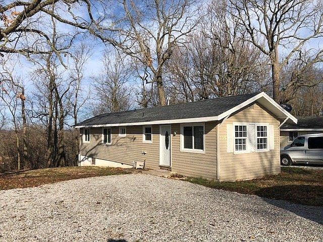 House backs into a woods. There are no neighbors to the left.