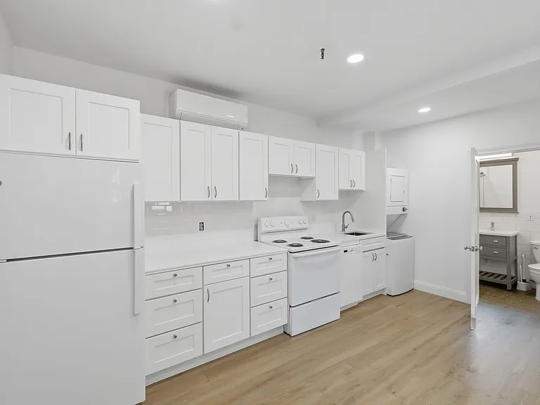 View of Kitchen, Private Laundry, and Bathroom