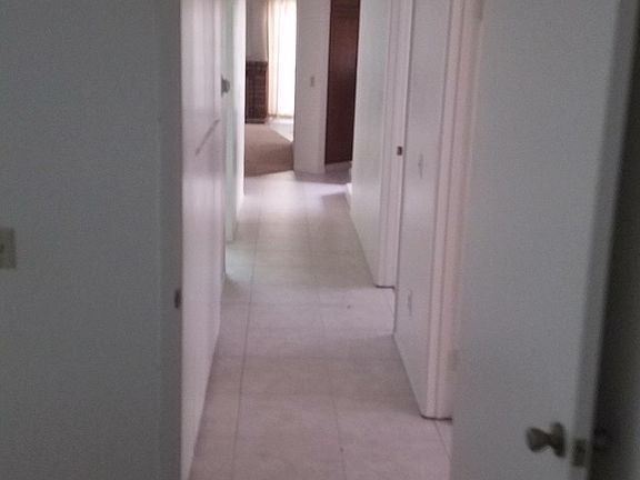 Neutral carpet and porcelain tile