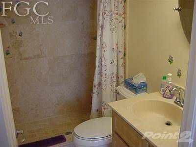 MASTER BATHROOM WITH TILED SHOWER, MARBLE SINK AND NEW FIXTURES.
