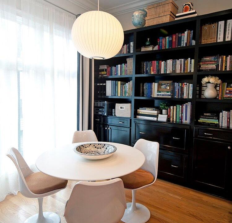 Keeping/breakfast room with custom built-in shelving. Half-