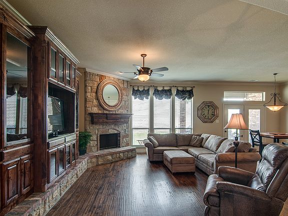 Large open living area with beautiful built-ins.