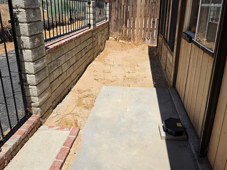 Backyard with gate to walking path