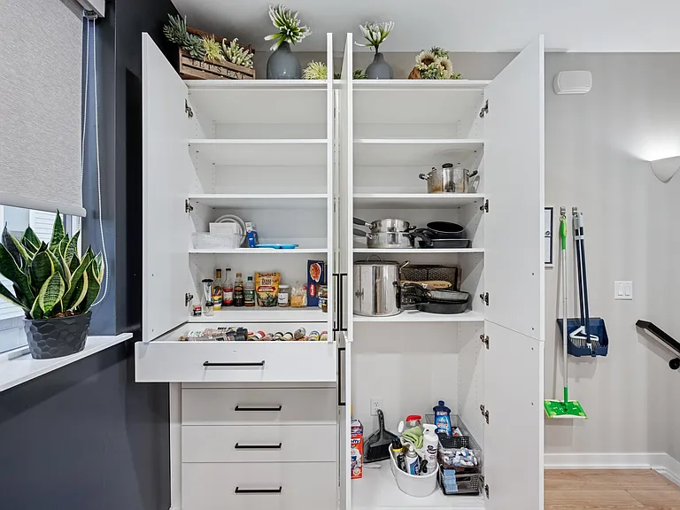 Did I mention the kitchen is fully loaded? Pots and pans in multiple sizes including a cast iron pan, plasticware, spices, cleaning supplies, condiments, pantry staples, baking pans, muffin tins, and even a pizza oven peel and cutter! Lots of storage