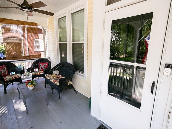 Front porch sitting area and door leading to the rental unit, which is a separate unit on the 2nd and 3rd floor of the home.