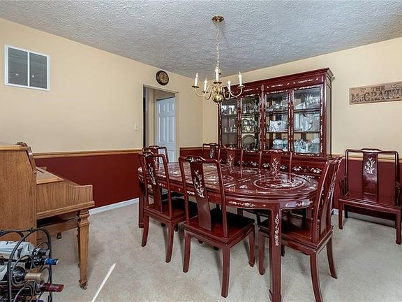 Spacious Dining Room with Chair Rail.  Perfect to Host Your Next Holiday Gathering!