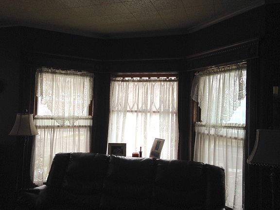 Living room with bay windows
