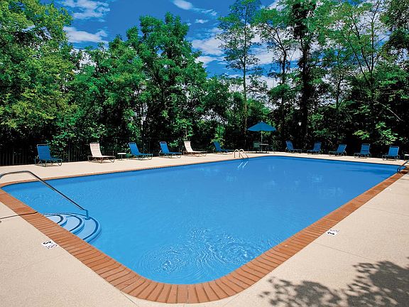 Lounge on the sundeck or cool off in the resort-style pool