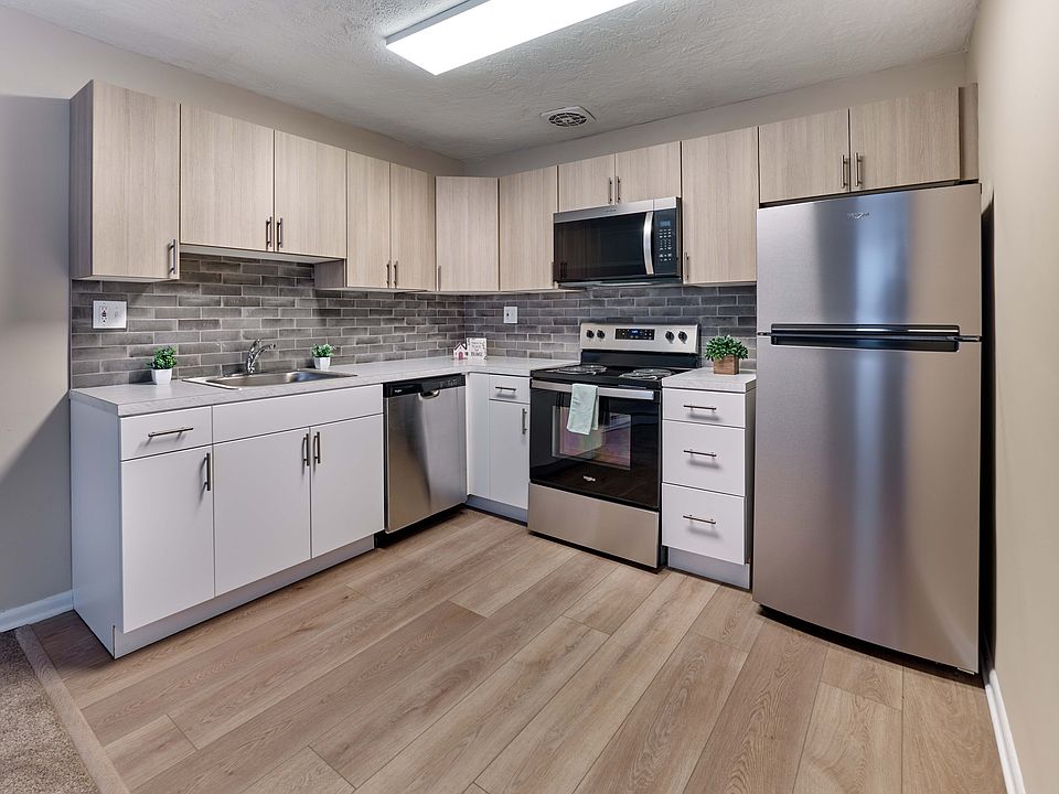 Stylish and functional kitchen with stainless steel appliances at Audubon Arms Apartments