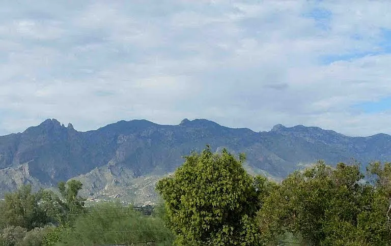 Stunning 180 degree view of Sta. Catalina mountains from master bedroom enclosed balcony.