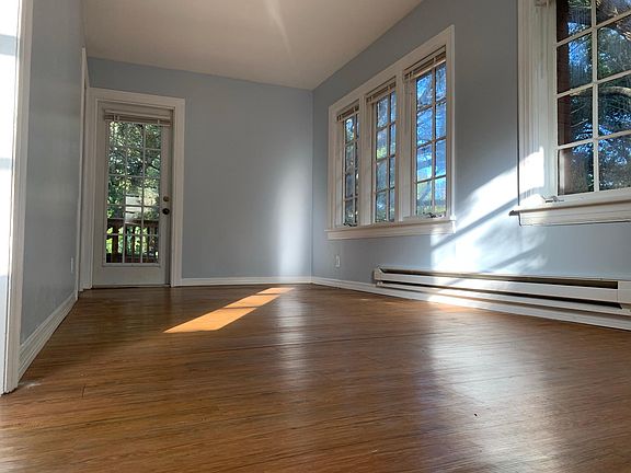 Bright and sunny living room with lots of windows to embrace natural light all day