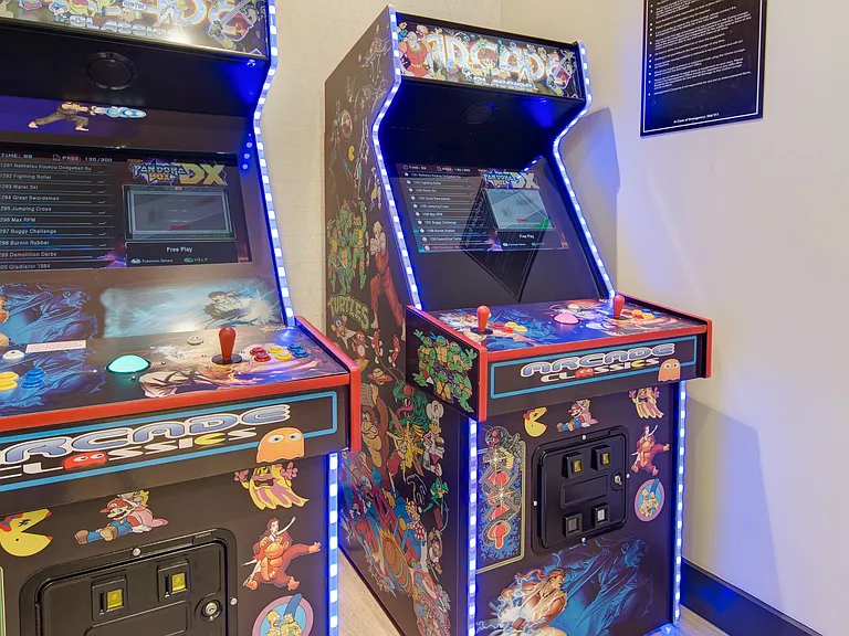 Resident lounge with game room featuring foosball, skee-ball, arcade games and shuffleboard.