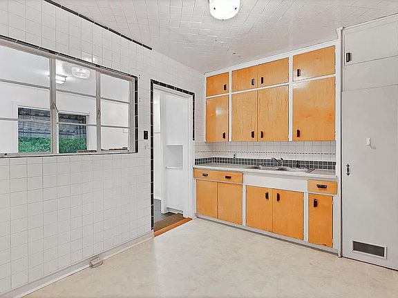 Kitchen (UPDATED PICTURE COMING SOON - new dishwasher, new refrigerator, new pantry, refinished cabinets, updated fixtures, new tile floor, and window removed!)