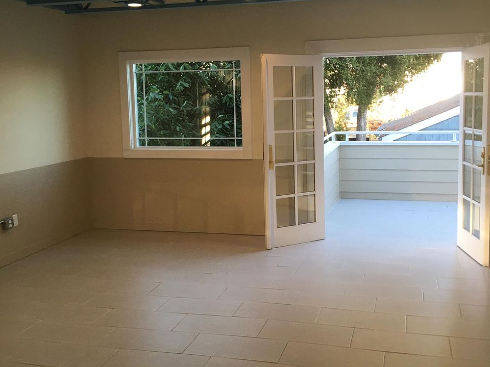 Main living room area looking out to the balcony with french doors.