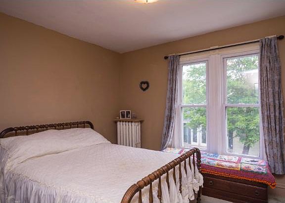 One of two spacious upper level bedrooms with hardwood floor