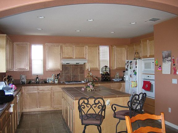 Kitchen, maple cabinets and earthtone colored tile, bullnose corners 