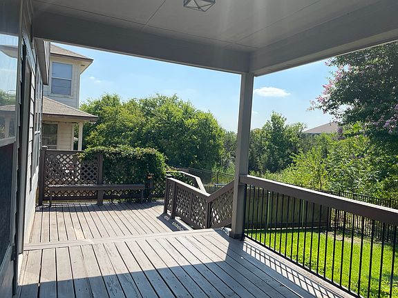 LARGE COVERED DECK SHADED IN THE AFTERNOON