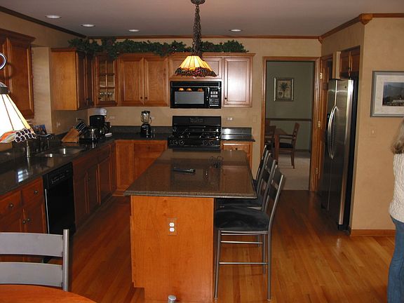 Kitchen with Silestone Counters and Stainless Fridge