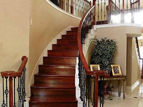 Sweeping staircase with Brazilian Cherry Wood steps