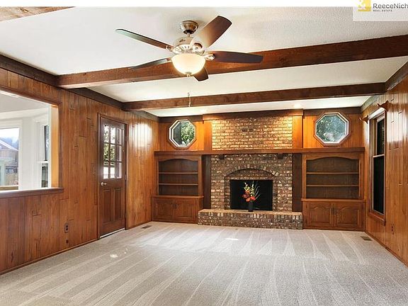 Great Room is open to the dining area! Door leads to HUGE new deck and backyard!