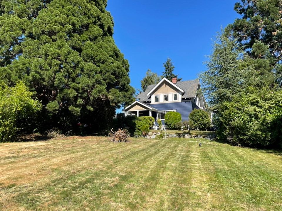 Front yard and the house_ the house faces the water. excellent puget sound views.